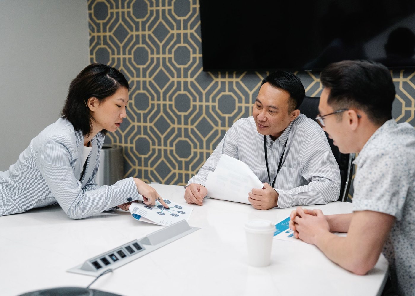 Two professionals discussing findings at a desk